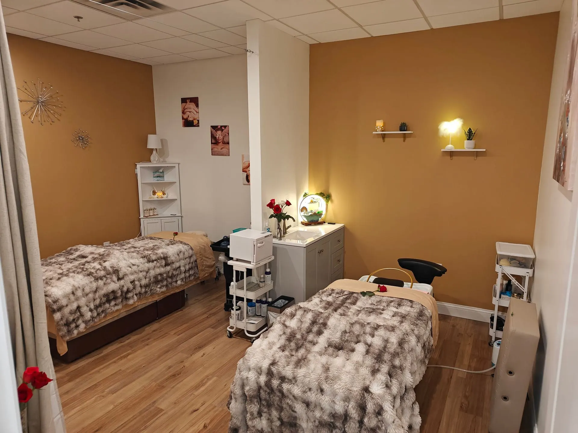 The joinable head spa room at Fiona's Day Spa in Coon Rapids, MN, set with two treatment tables side by side for a couples head spa